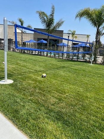 a soccer ball in the grass in front of a buildingat Westbury Apartments, Rancho Cucamonga, CA